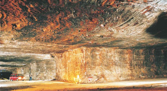 A photograph showing how some rock salt is mined, as is being done in a large underground deposit in Cheshire in England.  Much rock salt is also pumped as brine to the surface from the underground deposits.